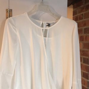 White bell sleeved blouse